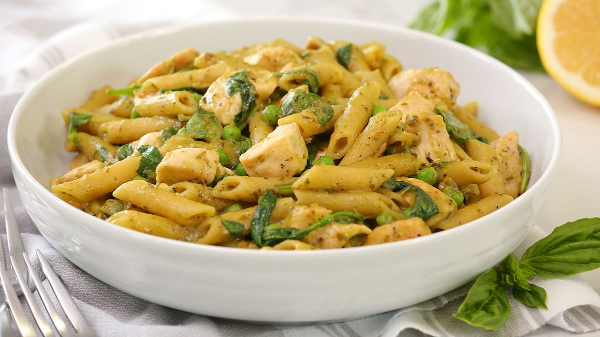 Creamy chicken penne pasta in a white bowl